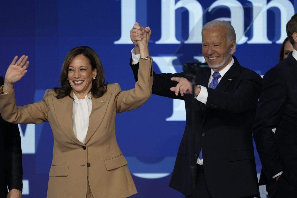 President Joe Biden raises Vice President Kamala Harris’ hand during the Democratic National Convention in Chicago, on Monday, Aug. 19, 2024.