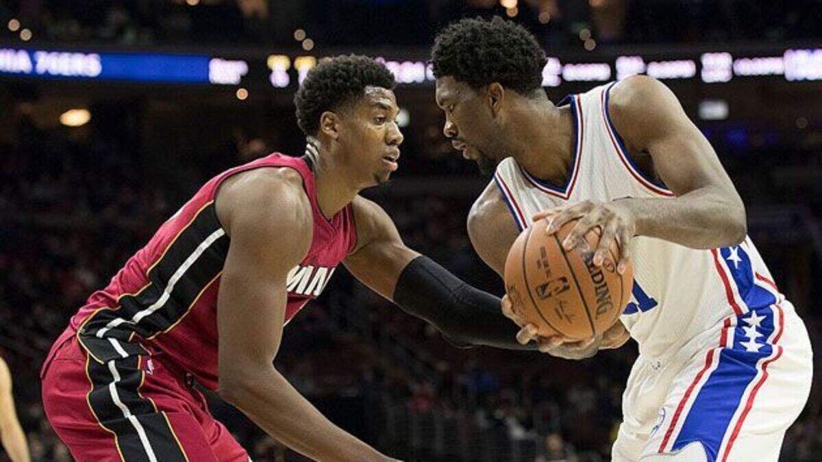 Hassan Whiteside plays against the Sixers' Joel Embiid earlier this season.