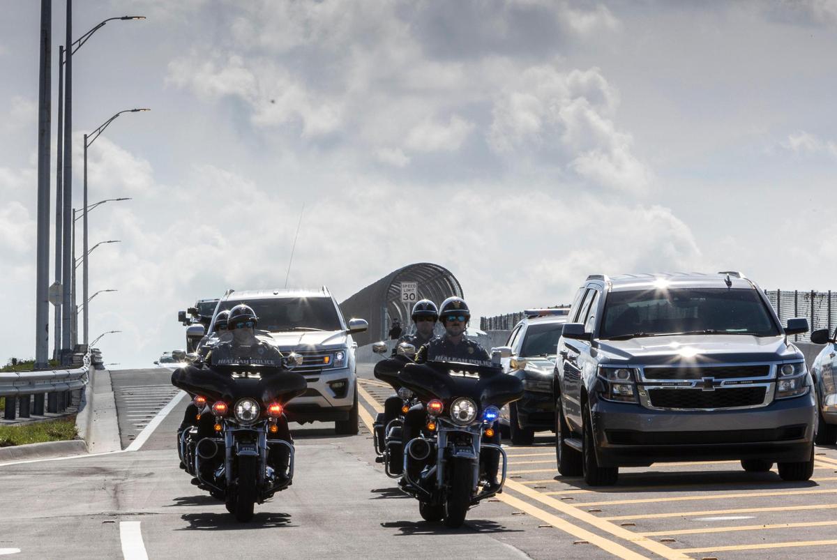A caravan including emergency and law enforcement vehicles crosses the Northwest 170th Street bridge that crosses Interstate 75 and connects Hialeah and Miami Lakes after an opening ceremony presided by Hialeah Mayor Esteban Bovo Jr., who was joined by a group of elected officials and residents.