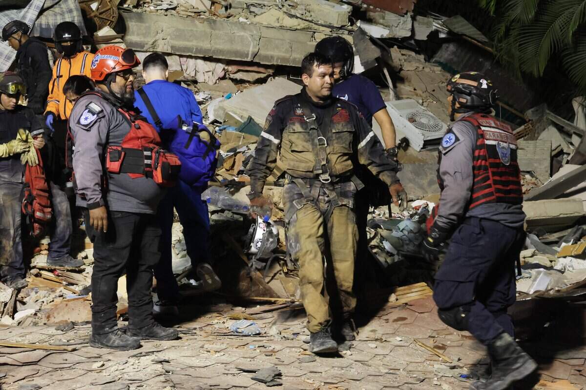 CARACAS, VENEZUELA - JUNE 24: Firefighters and responders search for victims in a demolished building at Los Palos Grandes after a magnitude 7.2 earthquake struck Venezuela and other regions in the Caribbean on June 24, 2026 in Caracas, Venezuela. According to the U.S. Geological Survey (USGS), the main earthquake was followed by a 7.5-magnitude aftershock less than a minute later; although some buildings collapsed, the number of victims remains unknown. (Photo by Edilzon Gamez/Getty Images)