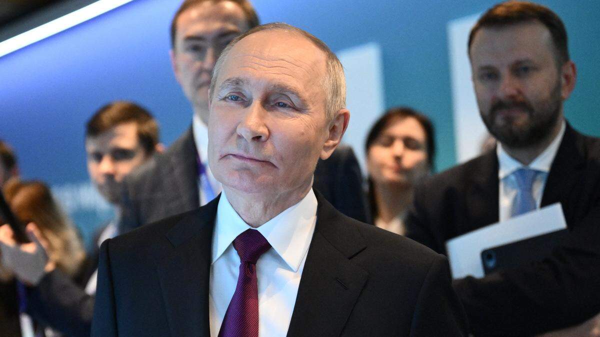 In this pool photograph distributed by the Russian state agency Sputnik, Russia's President Vladimir Putin visits an exhibition of the AI Journey international AI (Artificial intelligence) conference in Moscow on November 19, 2025. (Photo by Kristina Kormilitsyna / POOL / AFP) (Photo by KRISTINA KORMILITSYNA/POOL/AFP via Getty Images)