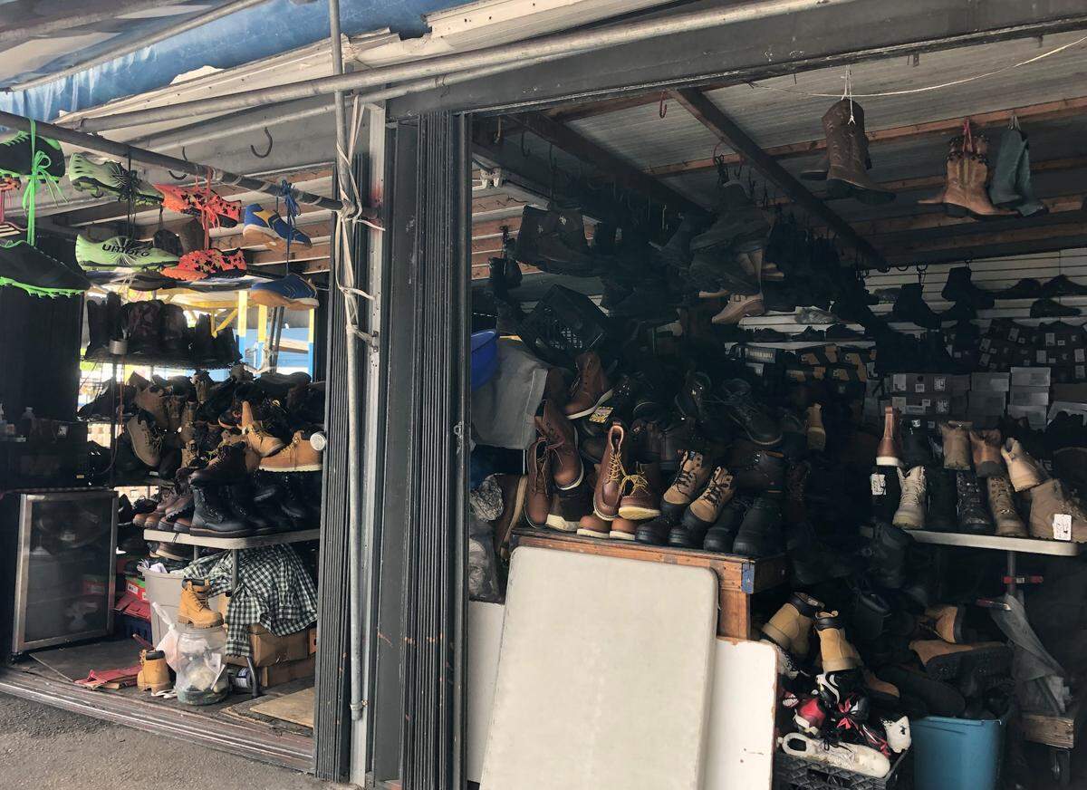 A store with an inventory of more than 2,000 pairs of shoes at the Opa−Locka Hialeah Flea Market.