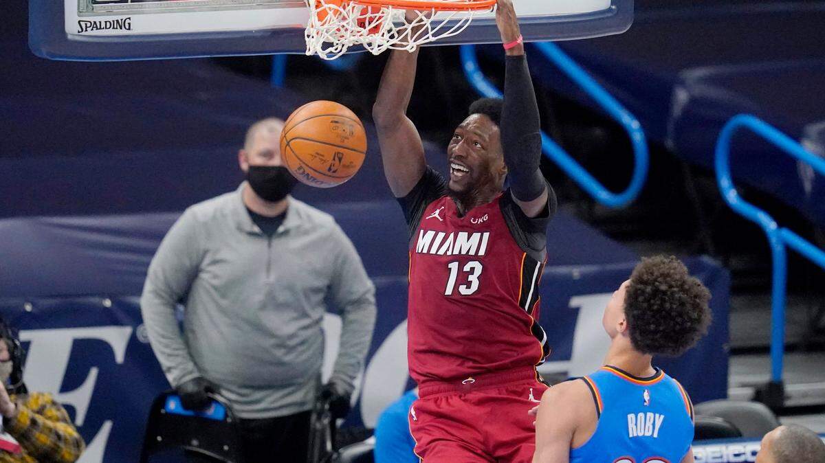 Miami Heat center Bam Adebayo (13) dunks in front of Oklahoma City Thunder center Isaiah Roby (22) in the first half of an NBA basketball game Monday, Feb. 22, 2021, in Oklahoma City. (AP Photo/Sue Ogrocki)