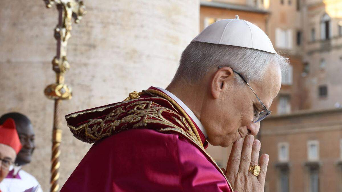New Pope Leo XIV, Cardinal Robert Prevost, bows to thousands of faithful gathered in St. Peter’s Square in Vatican City on Thursday.