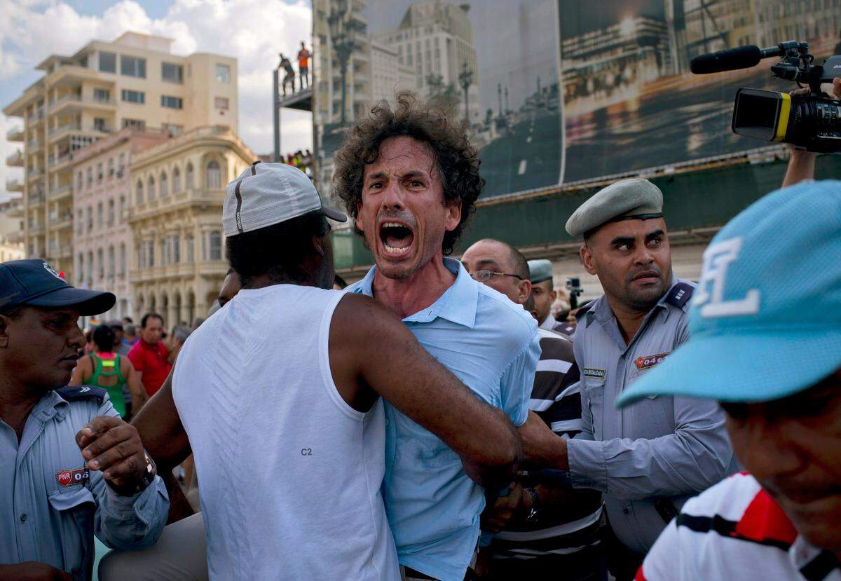 Cuban police detain a gay rights activist taking part in an unauthorized independent march in Havana, Cuba, Saturday, May 11, 2019. The march was organized largely using Cuba’s new mobile internet, with gay-rights activists and groups of friends calling for a march over Facebook and WhatsApp after the government-run gay rights organization, CENEX, canceled a Saturday march.
