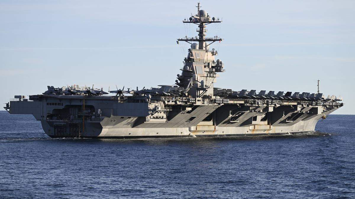 The world's largest aircraft carrier USS Gerald R. Ford seen in the North Sea during NATO Neptune Strike 2025 exercise on September 24, 2025 in the North Sea. Sailors, soldiers, aviators, and marines from 13 Allied nations are participating in NATO's Neptune Strike 25-3 military exercises, taking place from September 22-26 in the Baltic Sea and North Sea and involving the US aircraft carrier Gerald Ford. (Photo by Jonathan KLEIN / AFP) (Photo by JONATHAN KLEIN/AFP via Getty Images)