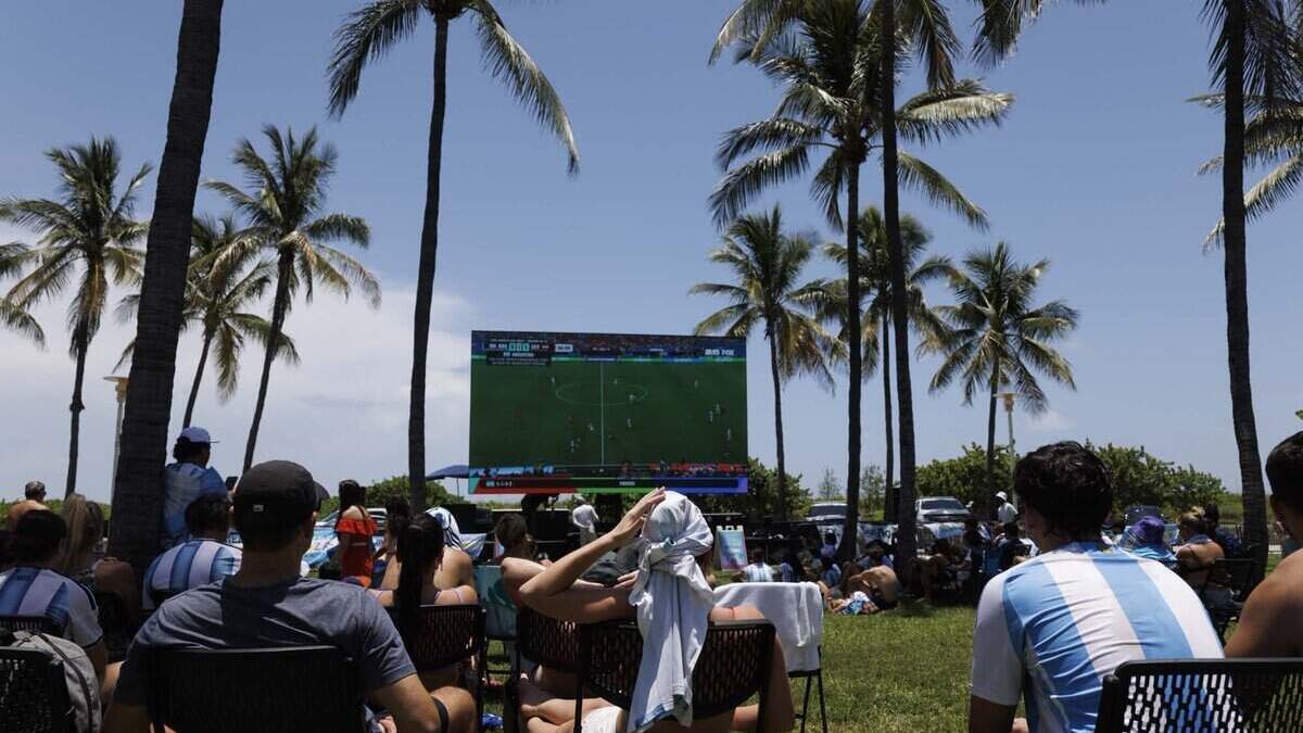 Fans watch the FIFA World Cup at a watch party during a heat advisory as they watch Argentina play Egypt on Tuesday, July 7, 2026, at Lummus Park in Miami Beach, Fla.