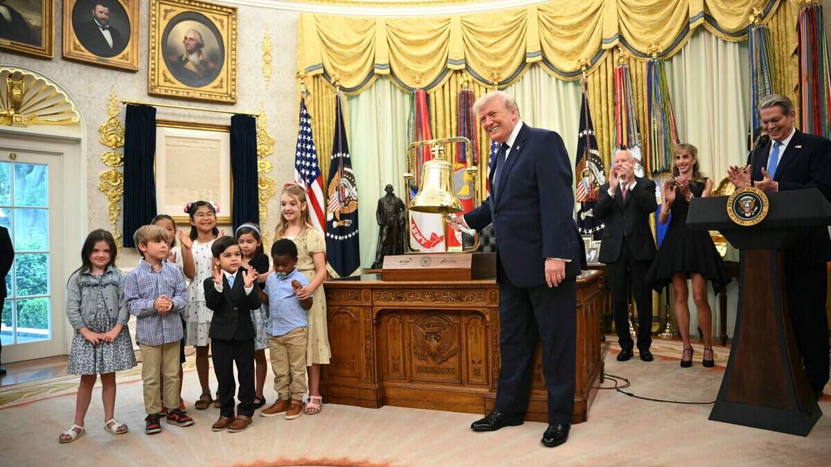 US President Donald Trump rings the opening bell of the New York Stock Exchange ahead of the launch of Trump investment accounts in the Oval Office of the White House in Washington, DC, on July 6, 2026. Trump accounts are a new type of tax-deferred investment accounts for children. (Photo by Mandel NGAN / AFP via Getty Images)