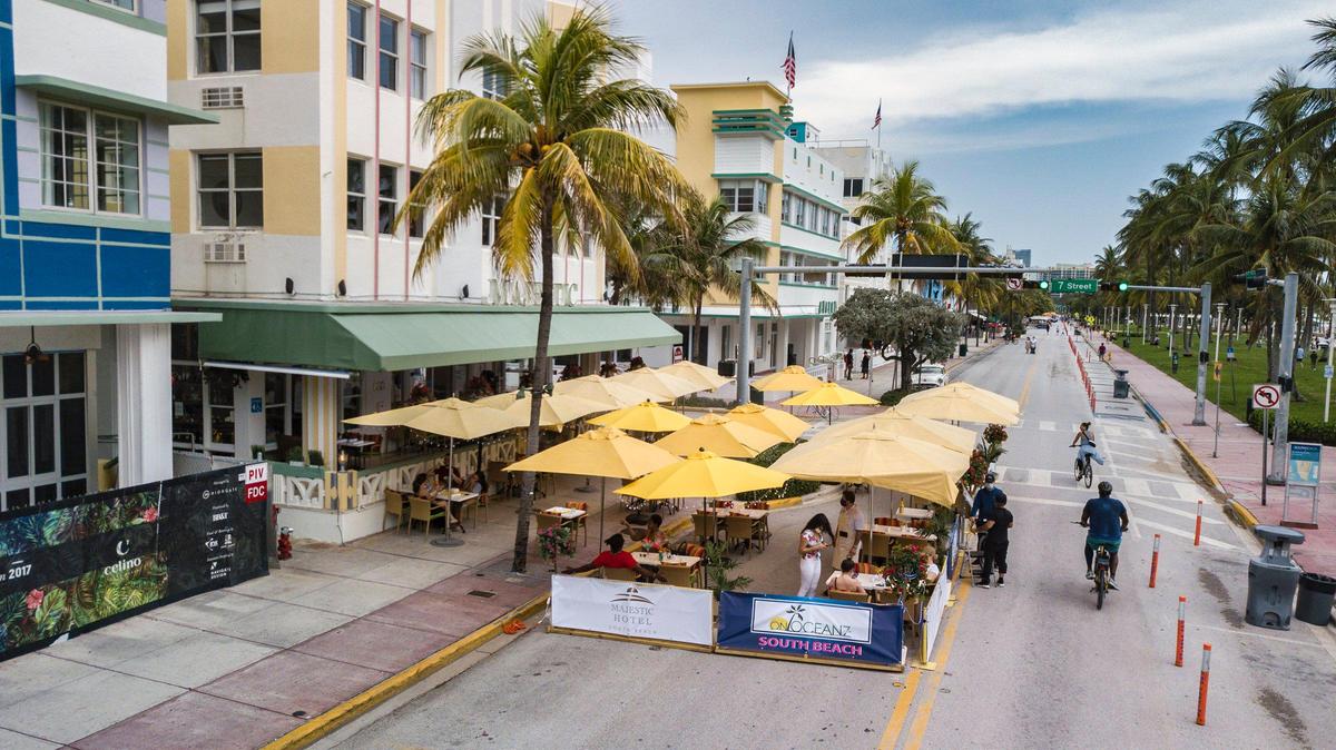 South Beach cafes have expanded onto street lanes closed to traffic on Ocean Drive.