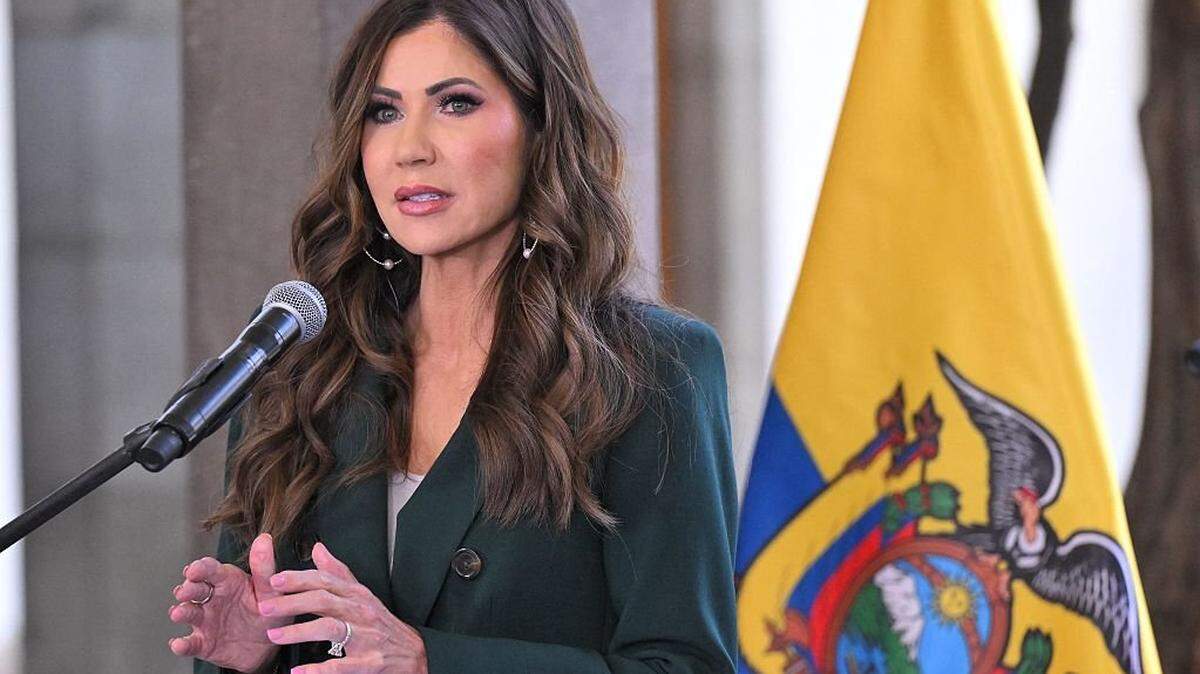 US Homeland Security Secretary Kristi Noem speaks netx to Ecuador's Minister of Interior John Reimberg (out of frame) as they deliver a press briefing at the Carondelet Presidential Palace in Quito, on July 31, 2025. (Photo by Rodrigo BUENDIA / POOL / AFP) (Photo by RODRIGO BUENDIA/POOL/AFP via Getty Images)