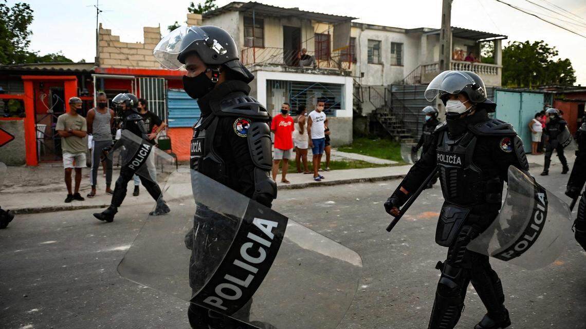 On July 12, riot police walk the streets in a Havana neighborhood after a demonstration against Cuba’s President Miguel Diaz-Canel.