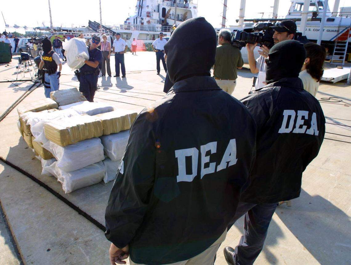 In this 2019 file photo, undercover DEA agents monitor a drug seizure in Miami Beach. A federal judge in Tampa who sentenced Jose Irizarry last year said other agents corrupted by the “allure of easy money” need to be investigated. “This has to stop,” Judge Charlene Honeywell told prosecutors, adding Irizarry was “the one who got caught but it is apparent to this court that there are others.”