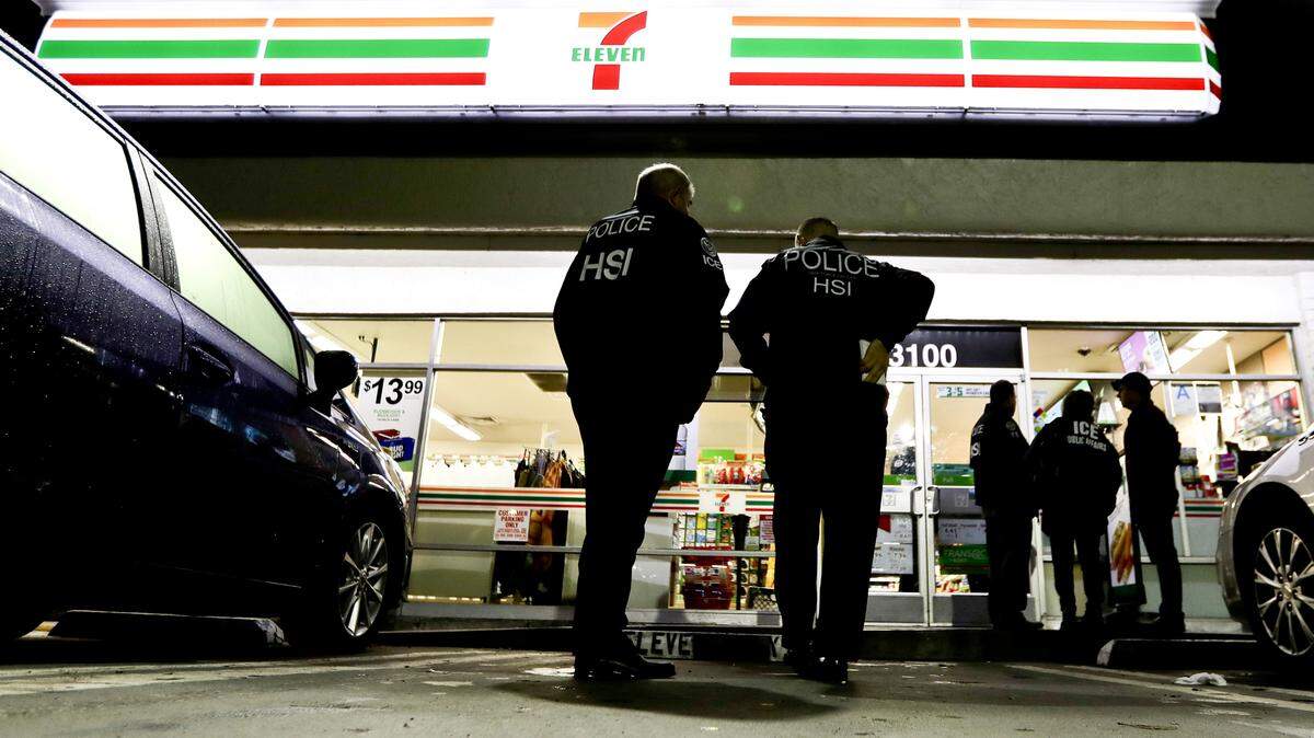 In this file photo from Wednesday, Jan. 10, 2018, U.S. Immigration and Customs Enforcement agents serve an employment audit notice at a 7-Eleven convenience store in Los Angeles. Immigration agents this week delivered inspection notices to 77 restaurants and other businesses in Northern California and gave them three workdays to prove their employees are authorized to work in the country. ICE agents served notices Monday through Wednesday to businesses in Sacramento, San Jose and San Francisco. A notice of inspection asks business owners to produce so-called I-9 forms, which employees are required to fill when first hired to confirm they are legally authorized to work. The audits come two weeks after California Attorney General Xavier Becerra warned business owners they could face fines of up to $10,000 if they violate a new state law that bars them from turning over workers' records to federal authorities. (AP Photo/Chris Carlson, File)