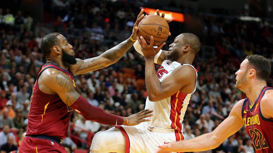 Miami Heat Dwyane Wade charges the basket as Cleveland Cavaliers LeBron James defends in the first quarter at the AmericanAirlines Arena in Miami, Florida, March 27, 2018.