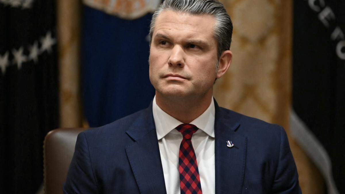 US Secretary of Defense Pete Hegseth listens as President Donald Trump speaks during a Cabinet Meeting in the Cabinet Room of the White House in Washington, DC on December 2, 2025. (Photo by ANDREW CABALLERO-REYNOLDS / AFP via Getty Images)