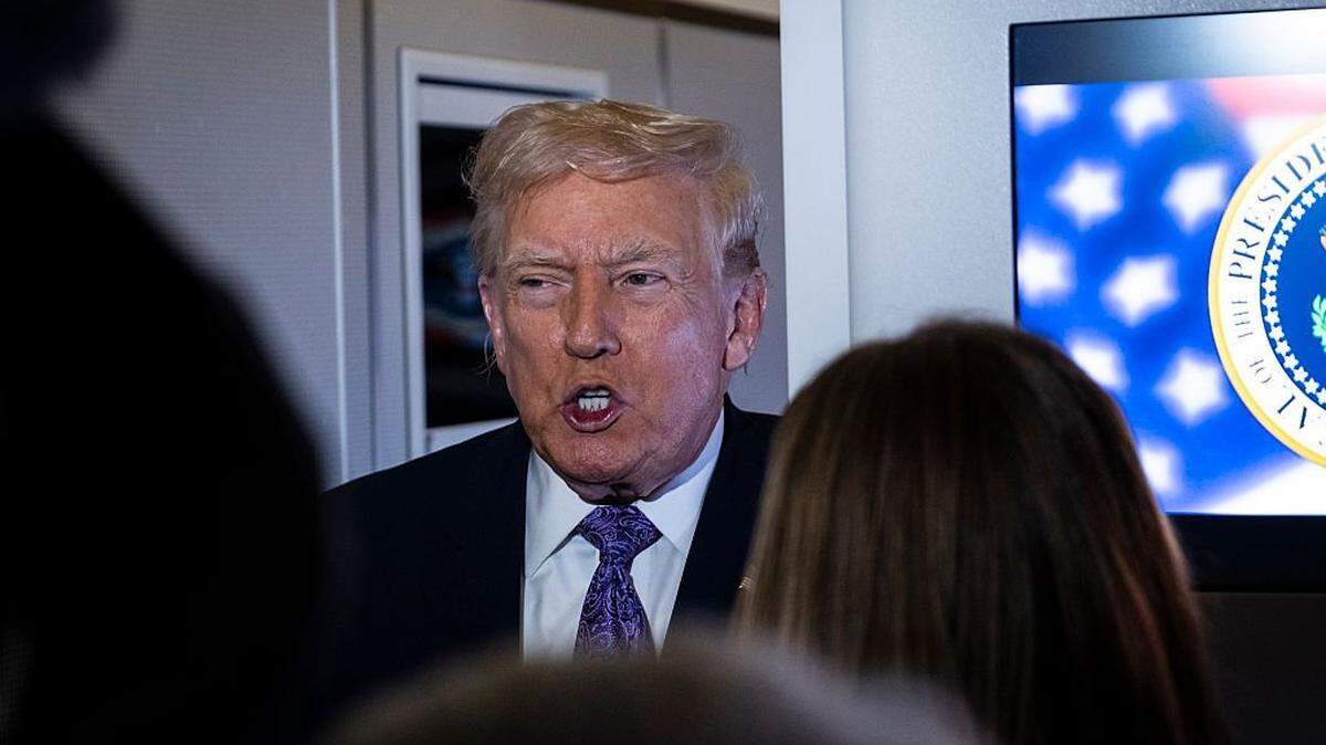 IN FLIGHT - NOVEMBER 30: President Donald Trump speaks to the press aboard Air Force One en-route to Washington, DC on November 30, 2025. The first family is returning to Washington, DC after spending the Thanksgiving holiday at Mar-A-Lago Resort In Florida. (Photo by Pete Marovich/Getty Images)