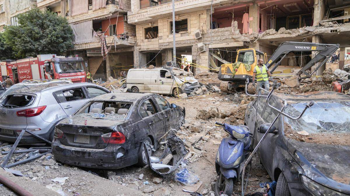 Rescuers sift through the rubble at the scene of an Israeli strike that targets Beirut’s southern suburbs, as search and rescue operations continue in Beirut, Lebanon, on September 21, 2024. Lebanon’s Hezbollah says on September 21 that a second senior commander is among 16 fighters killed in an Israeli air strike on its Beirut stronghold the previous day, highlighting the scale of the blow to its military leadership. (Photo by Fadel Itani/NurPhoto) (Photo by Fadel Itani / NurPhoto / NurPhoto via AFP)