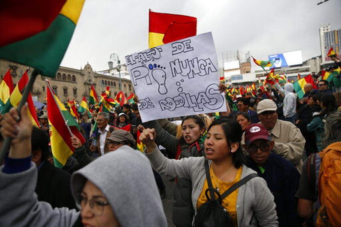 Anti-government protesters march demanding a a second round presidential election, in La Paz, Bolivia, Thursday, Oct. 24, 2019. Bolivia’s Evo Morales declared himself the outright winner Thursday of an election in which he was seeking a fourth term as president, enraging his opponents who alleged vote fraud and called for further protests to demand a second round of voting.(AP Photo/Juan Karita)