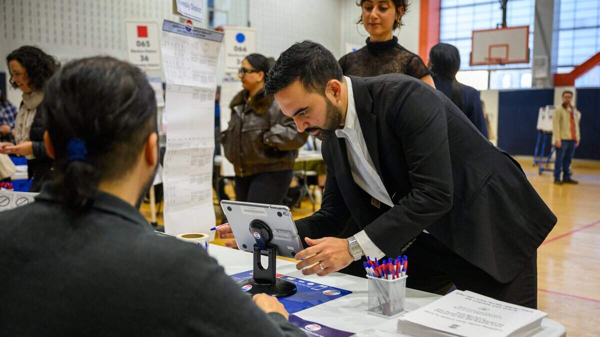 NEW YORK, NEW YORK - NOVEMBER 04: Democratic Mayoral Candidate Zohran Mamdani (R) and his wife, Rama Duwaji (L), votes at The Frank Sinatra School of the Arts on November 04, 2025 in the Queens borough of New York City. Voters in NYC are voting for who will be replacing Mayor Eric Adams between the front runner New York Mayoral Candidate Zohran Mamdani and New York City mayoral candidate Andrew Cuomo and Republican mayoral candidate Curtis Sliwa. More than 735,000 people have voted early, according to the Board of Elections, more than four times as many as in the 2021 contest. This election also has other city offices on the ballot, as well as six proposals. (Photo by Alexi J. Rosenfeld/Getty Images)