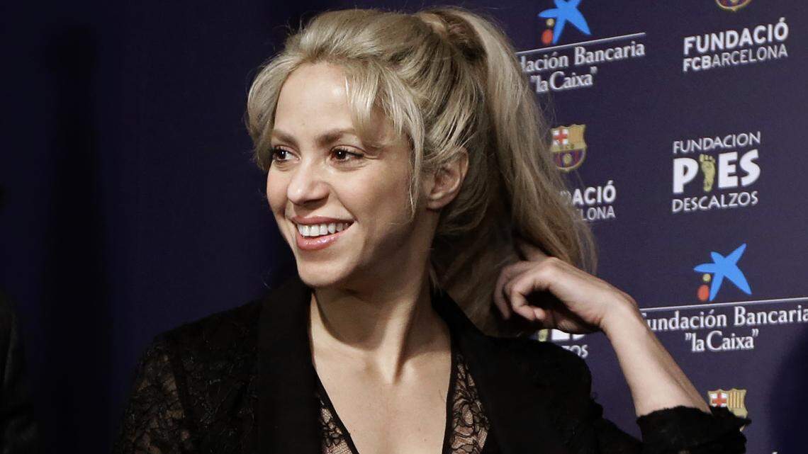 FILE - In this March 28, 2017 file photo, Colombian singer Shakira smiles before a press conference for a charity event at the Camp Nou stadium in Barcelona, Spain. Judicial authorities in Spain said on Tuesday, Jan. 23, 2018 pop music star Shakira is under investigation for possible tax evasion during the three years before she officially moved to Barcelona. Shakira switched residences in 2015 from Bahamas to Barcelona, where she lives with her partner, Barca soccer player Gerard Pique, and the couple’s two sons. (AP Photo/Manu Fernandez, File)