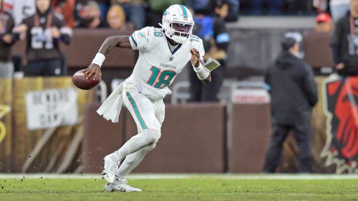 Miami Dolphins quarterback Tyler Huntley (18) scrambles against the Cleveland Browns during the first half of an NFL Football game at Huntington Bank Field in Cleveland, Ohio on Sunday, December 29, 2024.