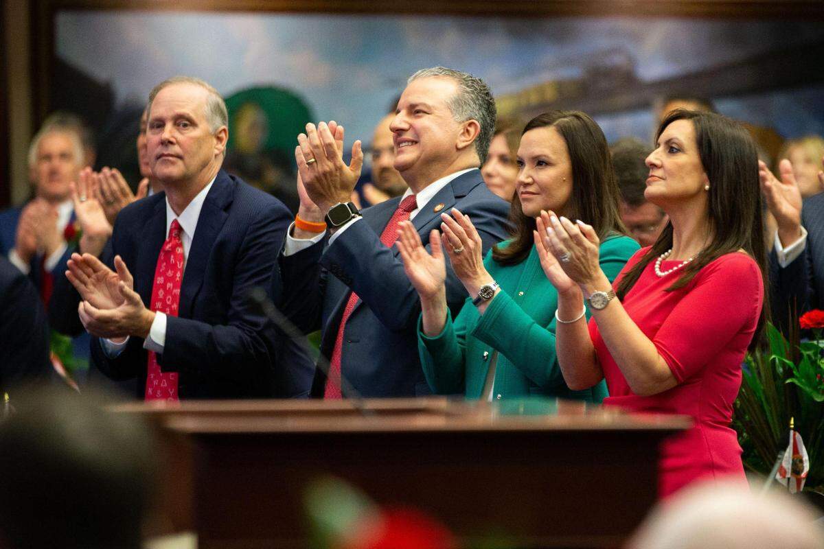 Florida Attorney General Ashley Moody, seen in green, on March 7, 2023 in the Florida Capitol.