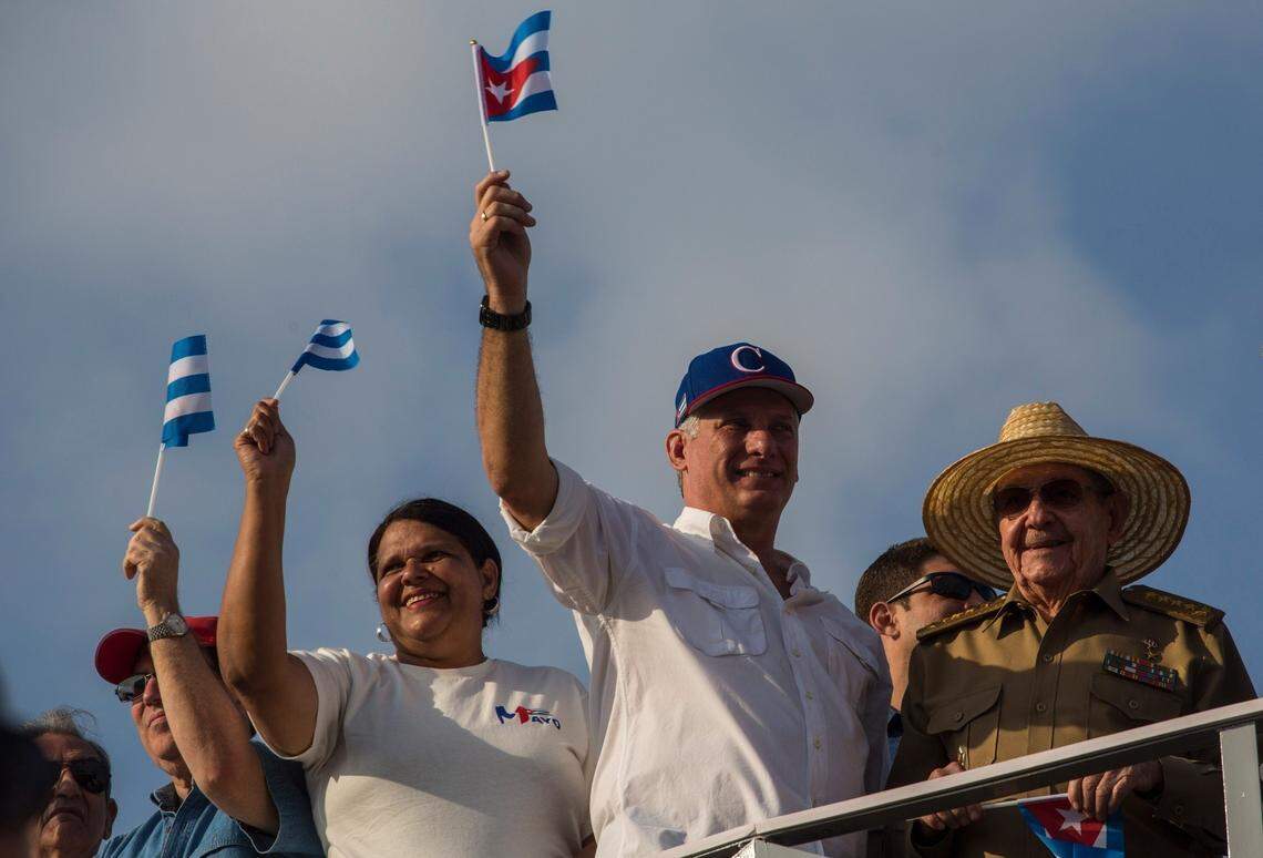 Miguel Diaz-Canel, center right, and  Raúl Castro observe the May Day parade in Havana's Plaza de la Revolución in 2018.