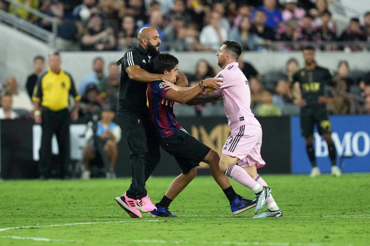Lionel Messi’s bodyguard Yassine Cheuko intercepts a field invader during an Inter Miami game against LAFC on Sept. 3, 2023 in Los Angeles, California.