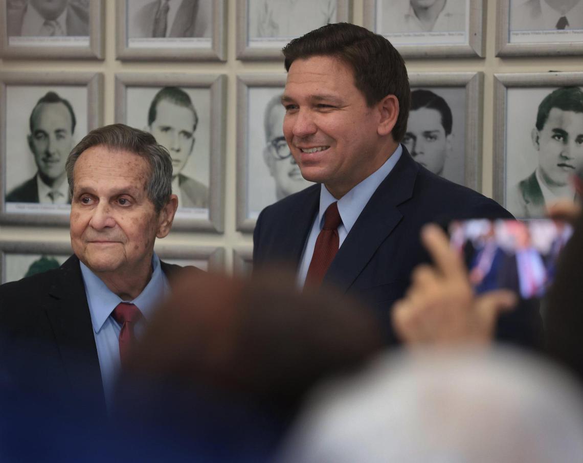 Governor Ron DeSantis, right, awards Cuban exile and decorated American veteran Felix Rodríguez, left, the Governor’s Medal of Freedom his press conference at the Hialeah Gardens Museum Honoring Assault Brigade 2506 on Thursday, September 16, 2021.
