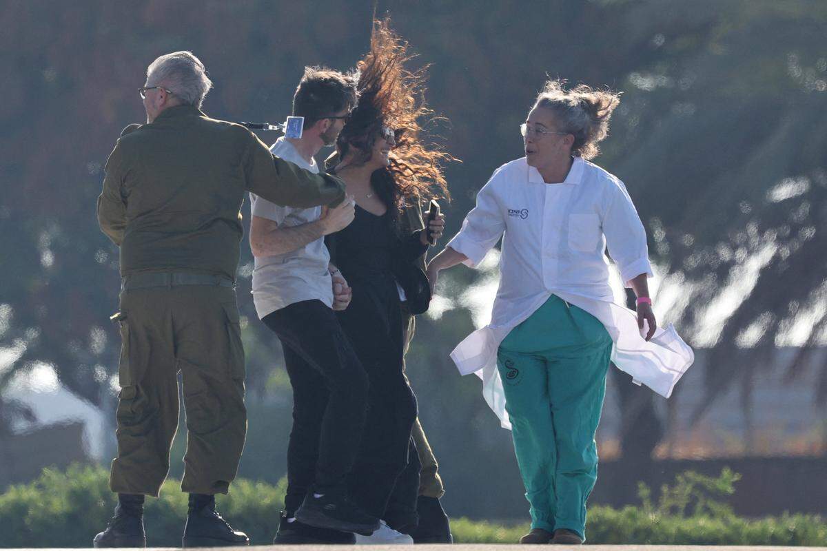 David Cunio, one of the released Israeli hostages formerly held captive in Gaza since the 2023 October 7 attacks by Palestinian militants, is greeted upon his arrival at the Sheba Tel-HaShomer Medical Centre in Ramat Gan on October 13, 2025. (Photo by Ahmad GHARABLI / AFP) (Photo by AHMAD GHARABLI/AFP via Getty Images)