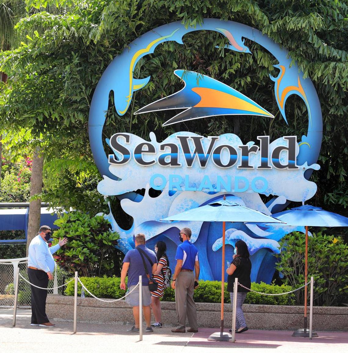 Sea World Orlando president Kyle Miller, left, talks to invited guests during a media preview on Wednesday, June 10, 2020, ahead of the formal reopening to guests on Thursday. The Orlando, Fla., park has been closed since March 16 due to the coronavirus pandemic. (Joe Burbank/Orlando Sentinel/TNS)