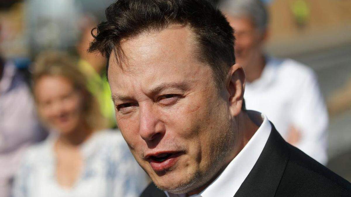 Tesla CEO Elon Musk talks to the media as he arrives to visit the construction site of the future U.S. electric car giant Tesla, on Sept. 3, 2020, in Gruenheide near Berlin.