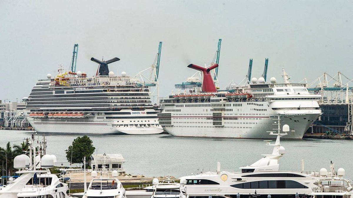 Carnival Vista, left, and Carnival Sensation of Carnival Cruise Line, are docked in PortMiami on April 21, 2021.