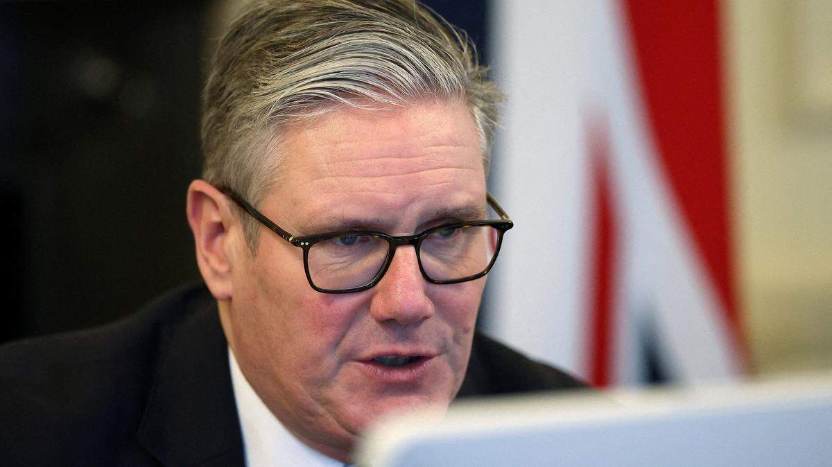 Britain's Prime Minister Keir Starmer looks at a screen as he co-chairs a 'Coalition of the Willing' meeting of international partners on Ukraine with other participants via video link, at 10 Downing Street in London on November 25, 2025. Starmer warned there was a "tough road ahead" to secure lasting peace in Ukraine, in comments made on November 25 before a call of the so-called Coalition of the Willing. (Photo by Toby Melville / POOL / AFP via Getty Images)