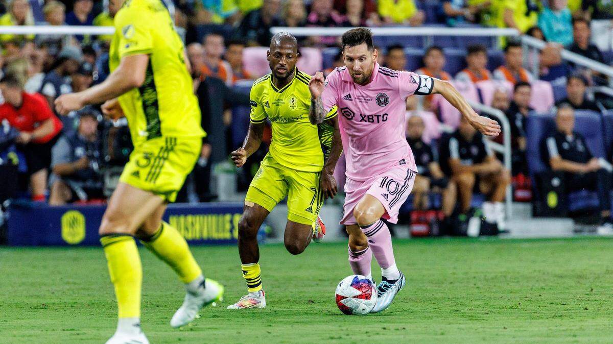 Inter Miami forward Lionel Messi (10) controls the ball as Nashville SC midfielder Fafà Picault (7) defends during the first half of their Leagues Cup final match at GEODIS Park on Saturday, Aug. 19, 2023, in Nashville, Tenn.