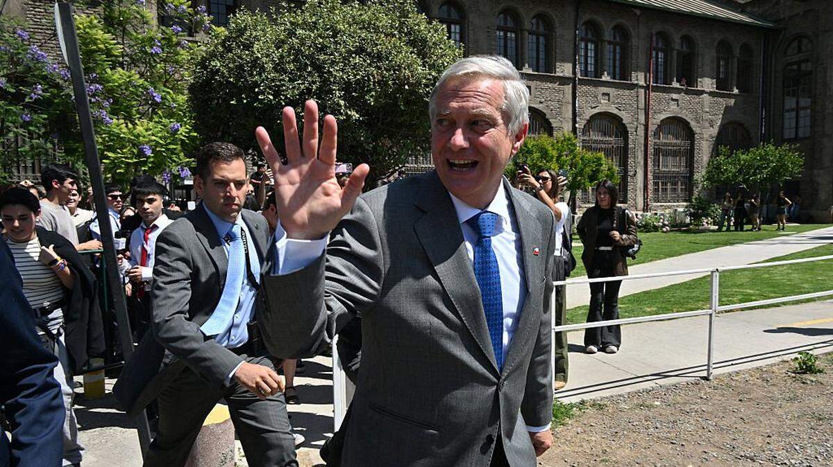 Chile's presidential candidate Jose Antonio Kast, of the Partido Republicano party, waves as he leaves after a debate organised by the Chilean Radio Association (Archi) in Santiago, on December 3, 2025. The clock is ticking down to a presidential run-off election on December 14, with far-right candidate Jose Antonio Kast the frontrunner to win the second round of voting against leftist Jeannette Jara. (Photo by RODRIGO ARANGUA / AFP via Getty Images)