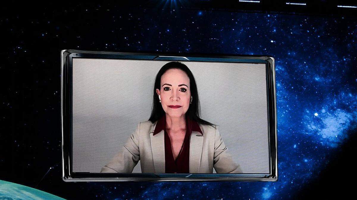 Venezuelan Nobel Peace Prize laureate MarÃa Corina Machado speaks remotely at the American Business Forum at the Kaseya Center in Miami on November 5, 2025. (Photo by CHANDAN KHANNA / AFP) (Photo by CHANDAN KHANNA/AFP via Getty Images)