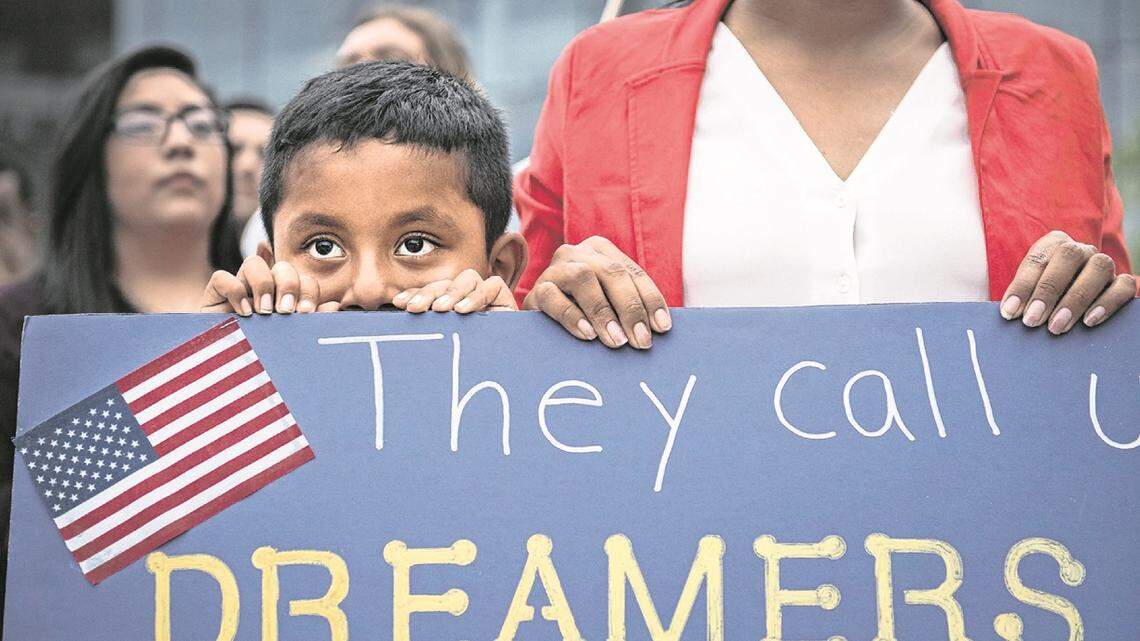 FILE ART: Esvin Sosa, 7, stands with his mom at a vigil on Sept. 5, 2017, in Greenville for Dreamers in response to Trump’s announcement to end DACA outside of the Peace Center.