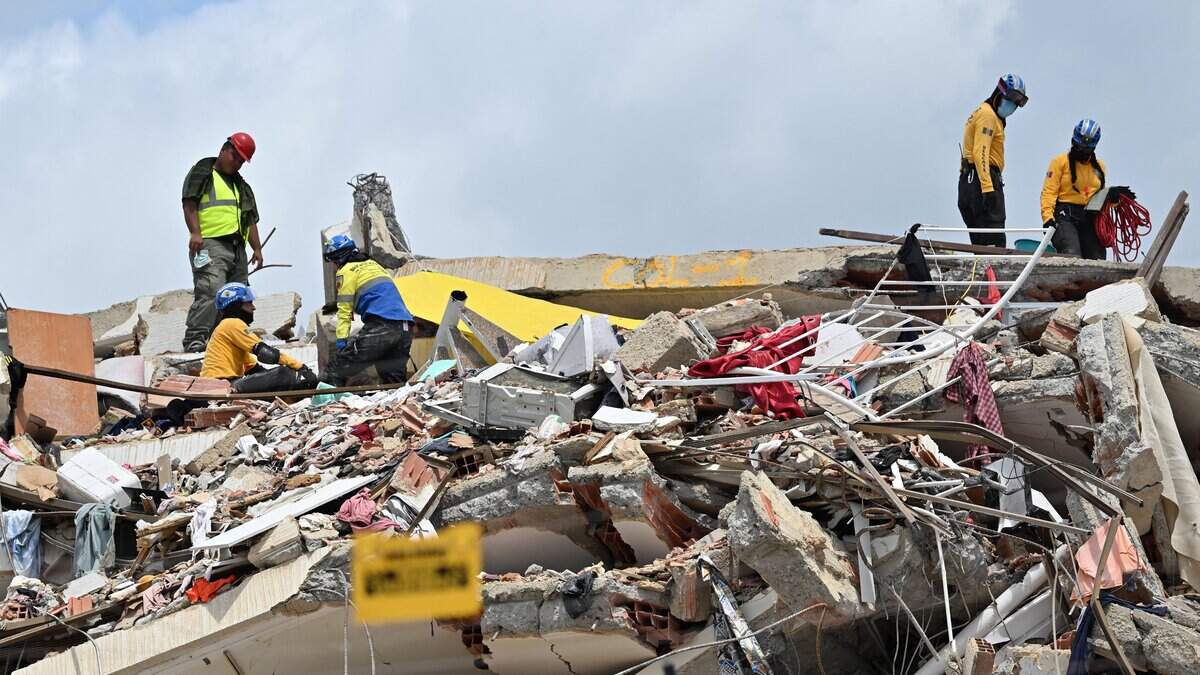 Rescuers work at the site of a collapsed building eight days after twin earthquakes, in Caraballeda, La Guaira state, Venezuela, on July 2, 2026,. More than a week after the earthquakes struck, there is little chance of finding additional survivors from the two earthquakes that killed nearly 2,300 people, destroyed entire residential buildings, and left tens of thousands missing. (Photo by MARTIN BERNETTI / AFP via Getty Images)