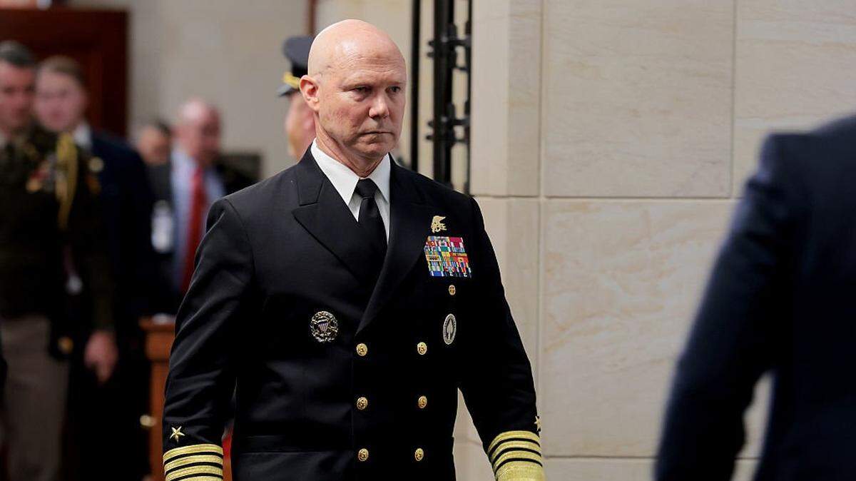 WASHINGTON, DC - DECEMBER 04: Navy Adm. Frank Bradley walks to a hold room in between attending closed-door classified meetings with lawmakers on Capitol Hill on December 4, 2025 in Washington, DC. Members of the Senate and House Armed Services committees met with Bradley about the strikes on suspected drug boats out of Venezuela ordered by the Trump Administration. (Photo by Anna Moneymaker/Getty Images)