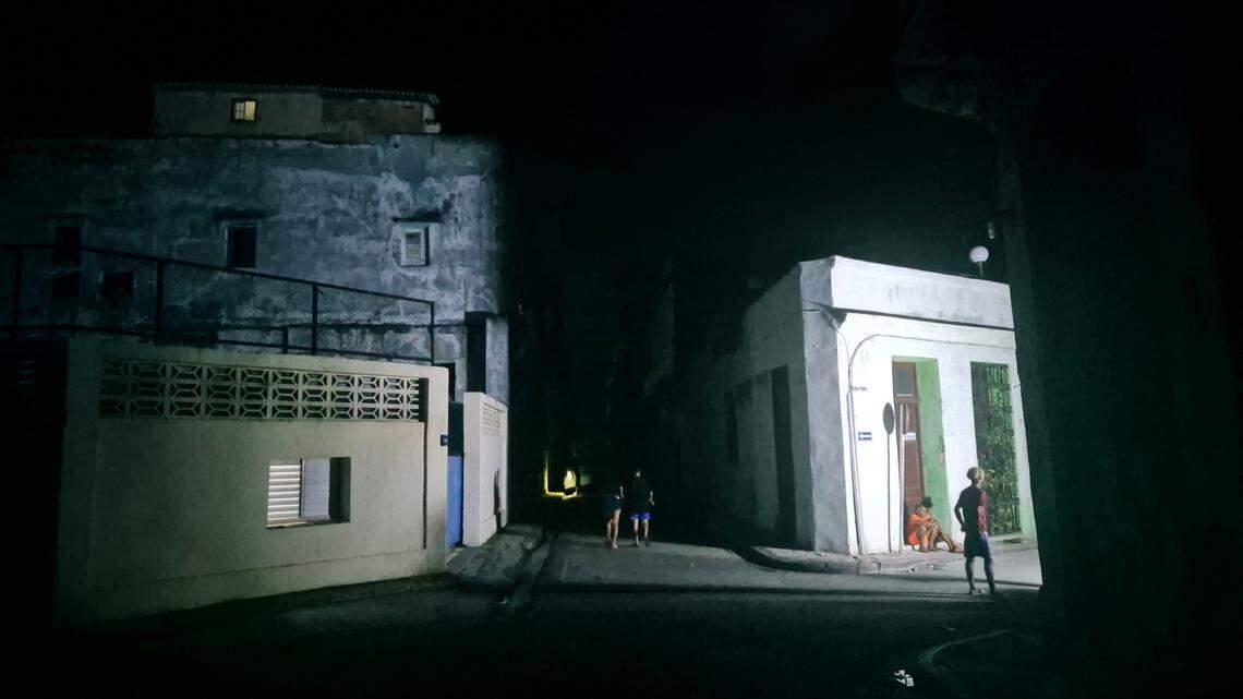 People walk on dark streets in the center of the Cuban capital during an island-wide power outage in October 2024. Photo: Nick Kaiser/dpa/Sipa USA