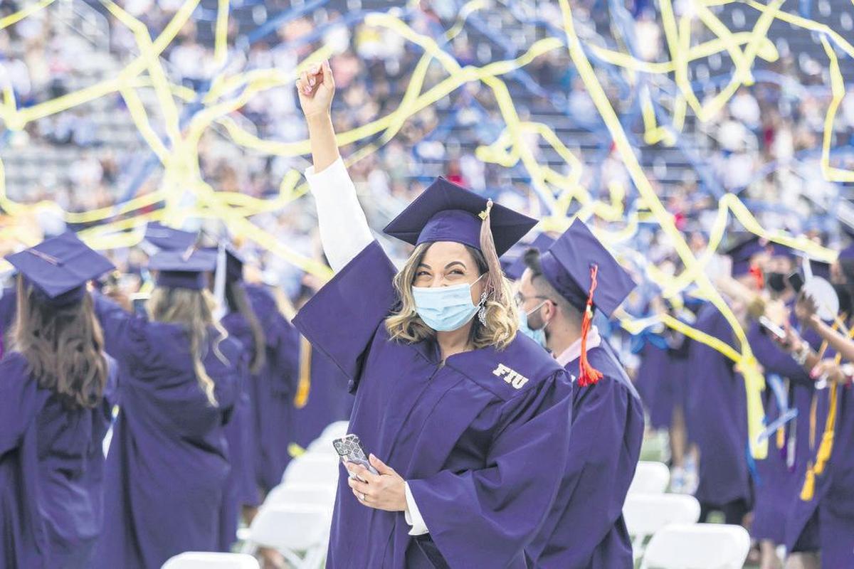 Julianny Guzman, 30, celebrates after graduating from Florida International University at the Riccardo Silva Stadium in Miami, Florida on Saturday, April 24, 2021.