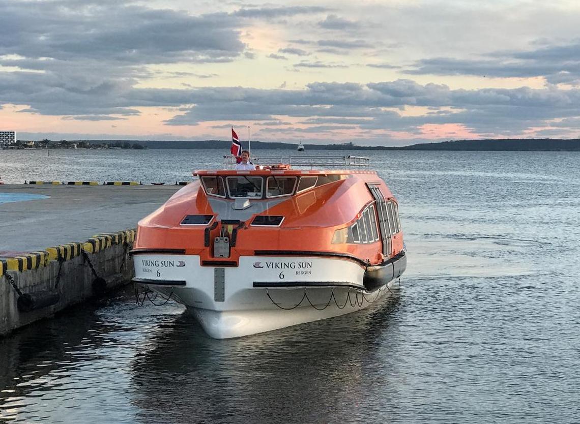 The pilot of one of Viking Sun's lifeboats pulls up at the dock in Cienfuegos. The boat, which doubles as a passenger tender, will take guests back to the ship, which is anchored in Cienfuegos Bay.